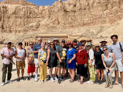 Tourists gather for a photo at the spectacular rock-cut Temple of Hatshepsut.