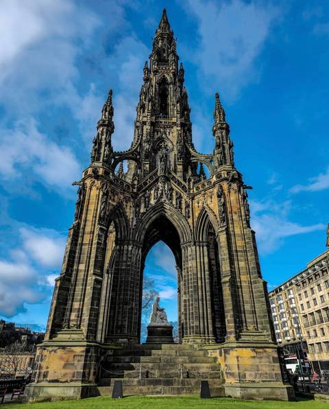 Edinburgh’s Gothic Scott Monument towers into a bright blue sky.