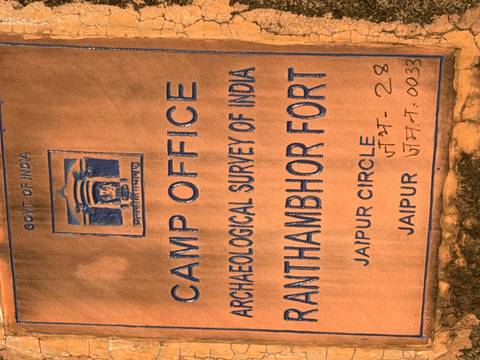 Weathered signboard for the Archaeological Survey of India Camp Office at Antambhor Fort, Jaipur Circle.