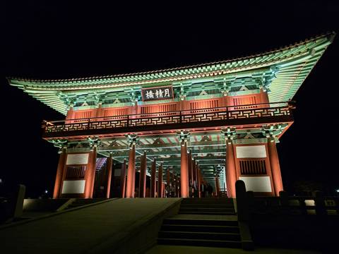 Beautifully illuminated traditional wooden bridge at night in Gyeongju