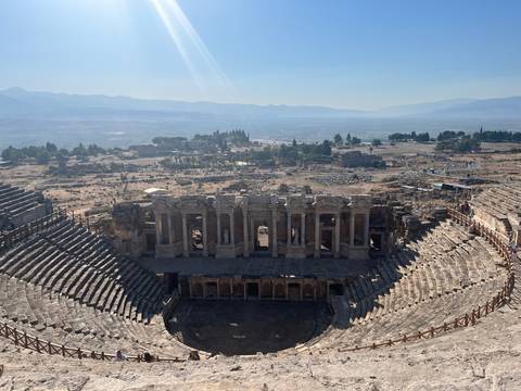 Panoramic view of the grand theatre of Hierapolis overlooking the sprawling ruins below.