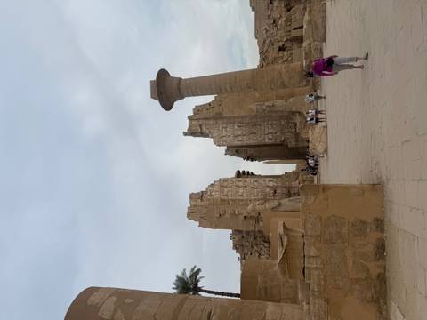 Towering columns and obelisk remnants of Karnak Temple dominate the ancient courtyard.