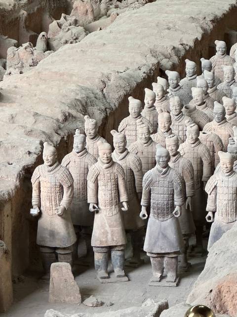 Terracotta Warriors exhibition in Xi'an, showing rows of clay soldiers.