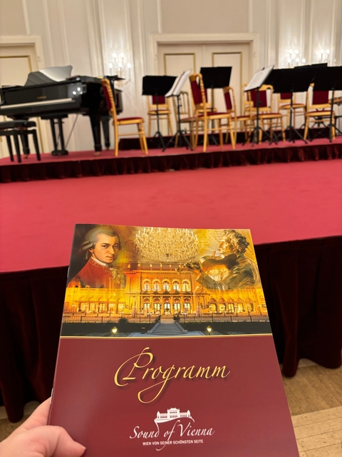 Concert program featuring famous composers and an orchestra setting.