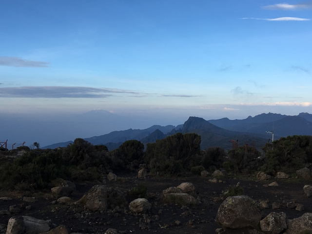 Mountains in the distance under a blue sky.