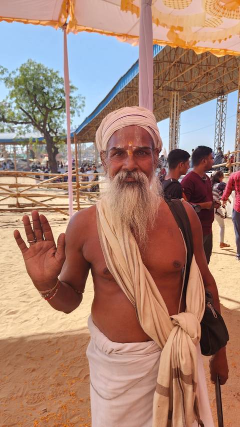 Man with long beard posing.