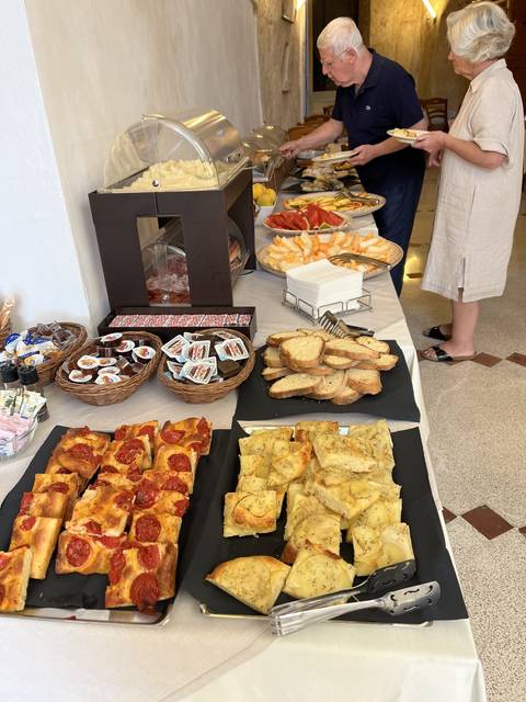 An assortment of food on a table at a buffet.
