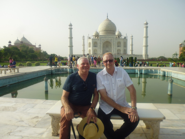Two men in front of the Taj Mahal.