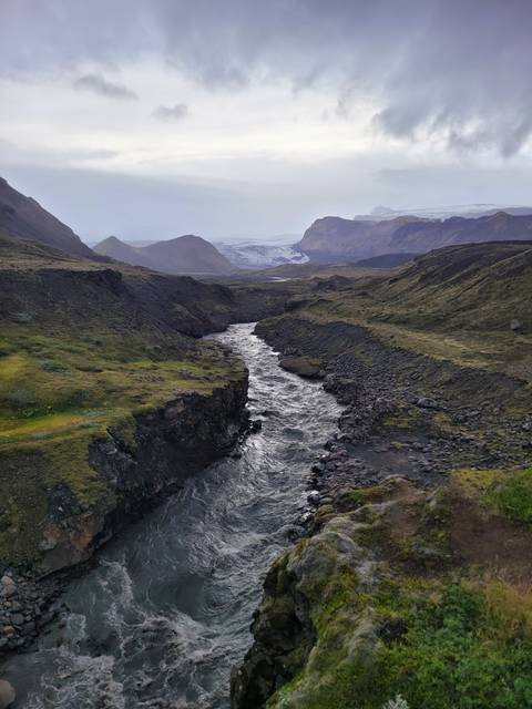 River flowing through a volcanic landscape.