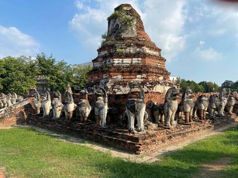 Upside-down view of ancient ruined temple with elephant statues.