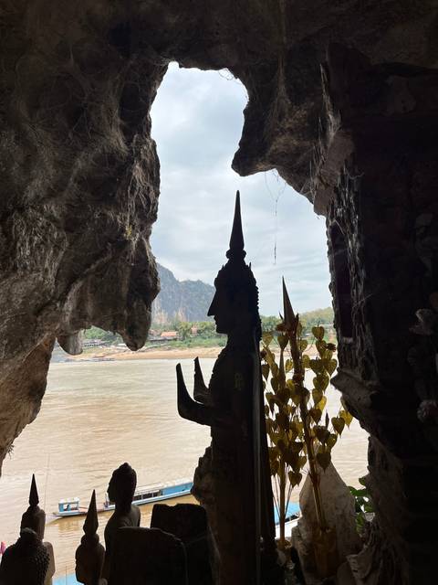 View from a cave frame overlooking a river.
