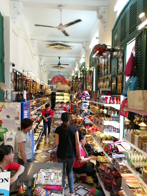 Busy tourist shop filled with colorful souvenirs.