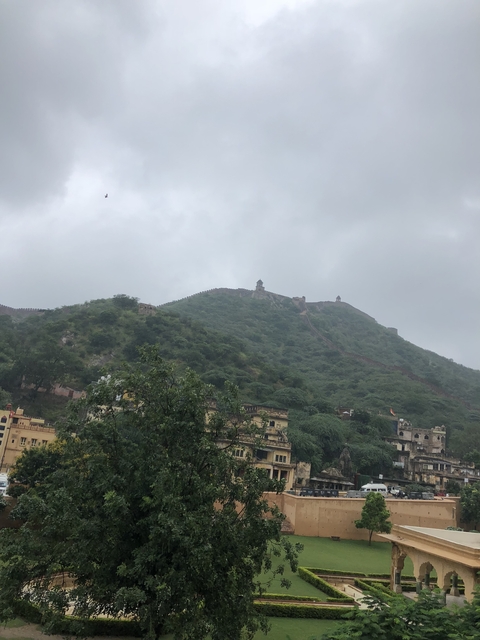 Hilly landscape with an ancient wall running along the ridgeline.
