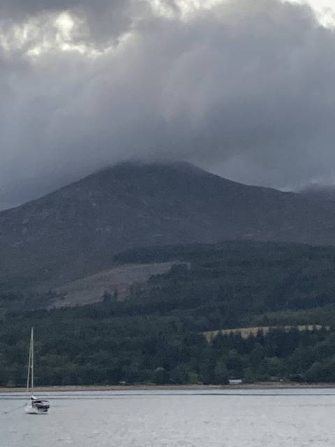 Mountain landscape with overcast sky.