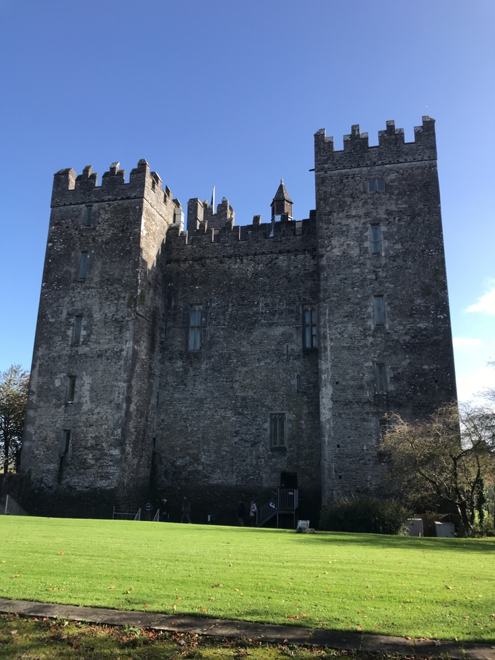 Large stone castle against a clear blue sky.