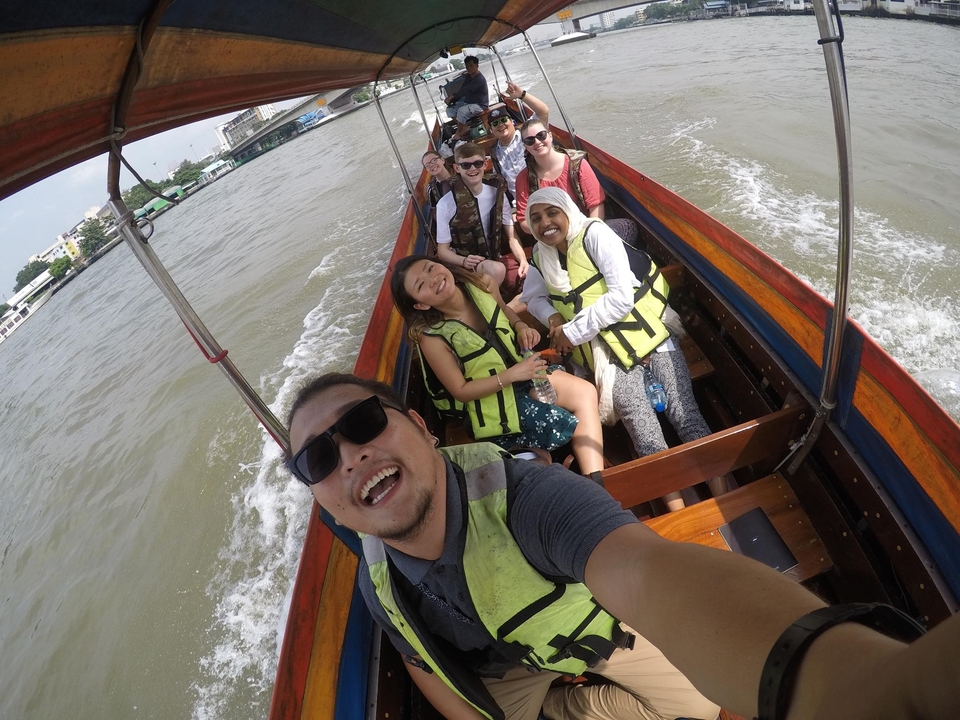 Group of people on a longtail boat ride.
