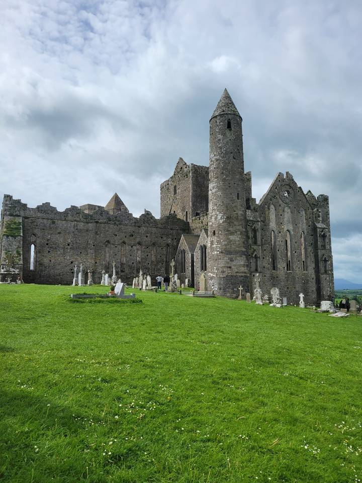 Ancient stone ruins on a grassy landscape.