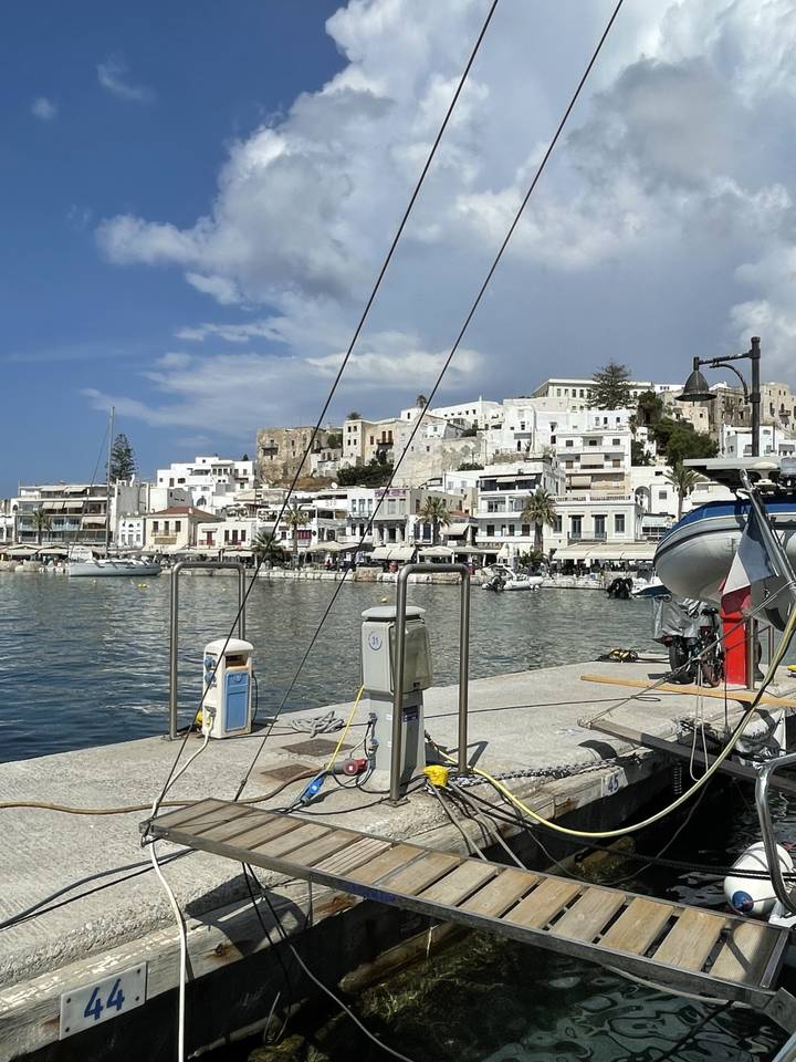 Harbor view with boats and white buildings.