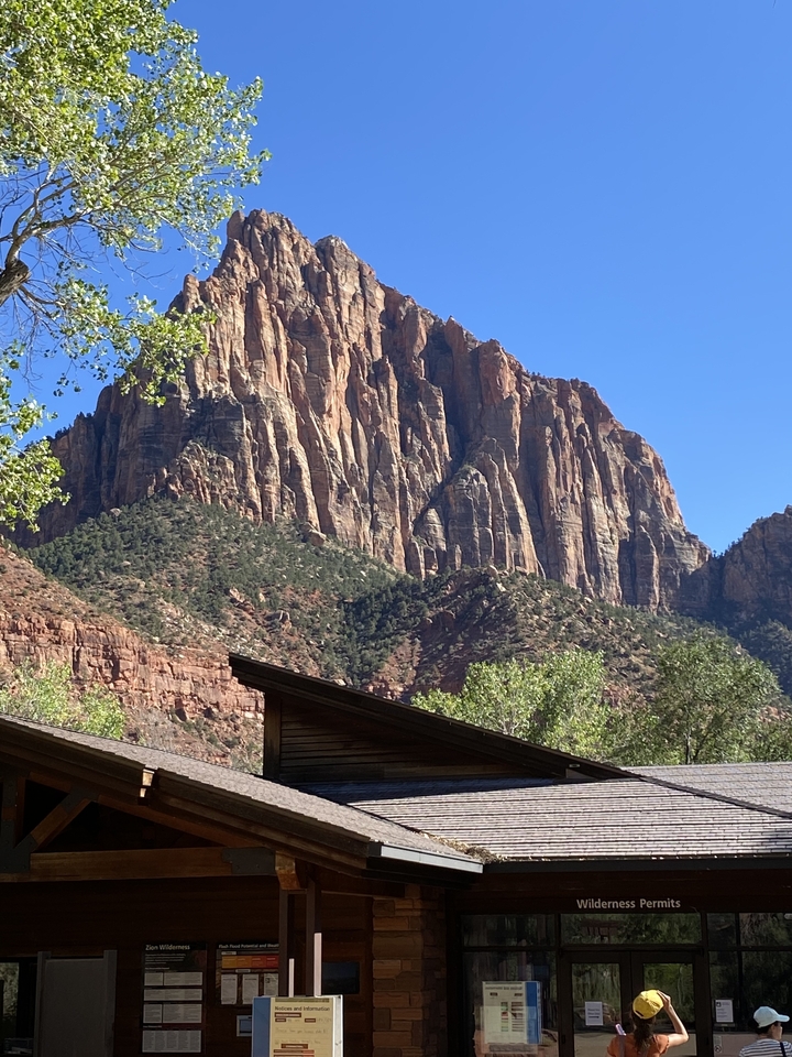 Majestic mountain landscape with a building in the foreground.