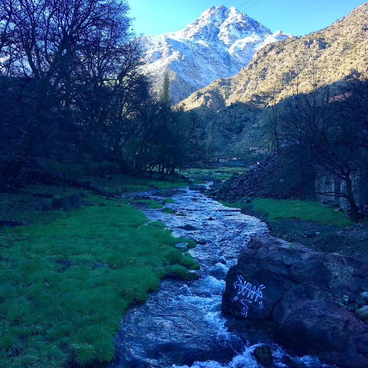 Pastoral landscape with a river streaming through a valley.