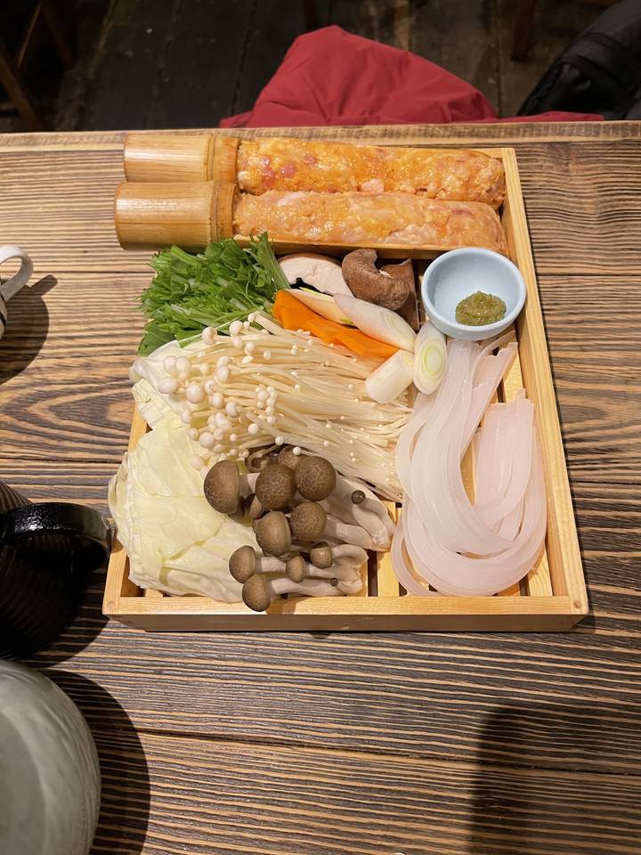 A variety of Japanese ingredients laid out neatly on a tray.