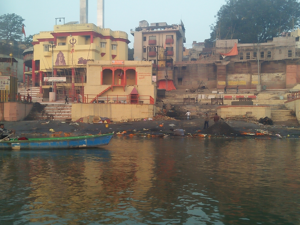 Ghats and colourful riverside temples lining the Ganges River in Varanasi.