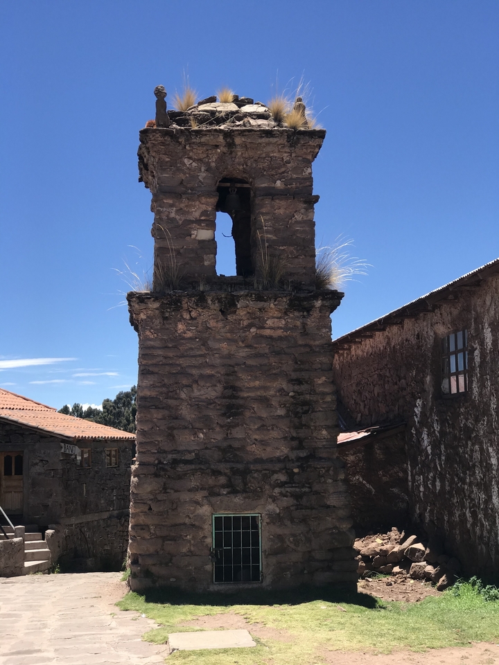 Close-up of a stone bell tower.