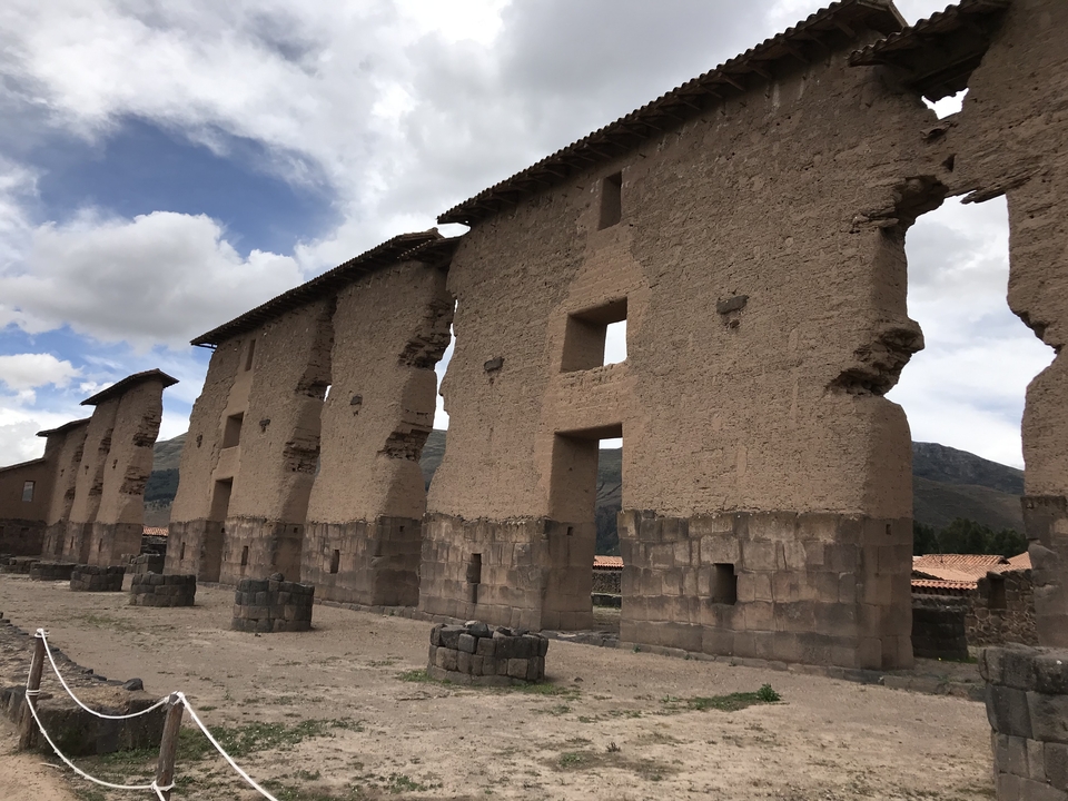 Ruins of an ancient structure with large, rectangular openings.