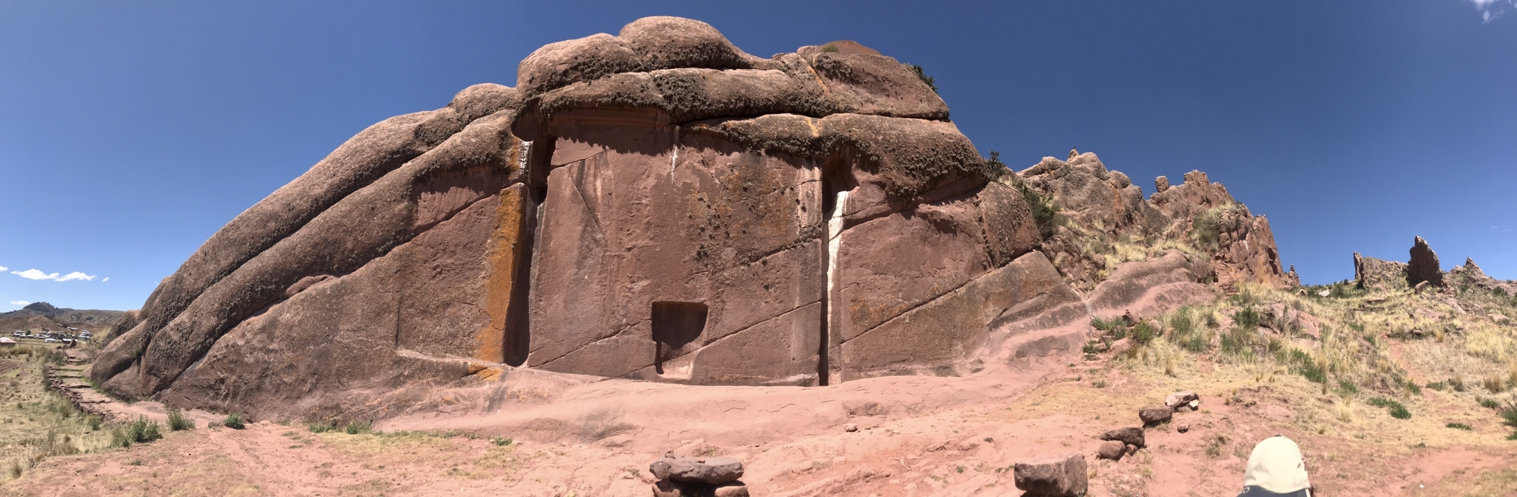 A large rock formation with carved features.