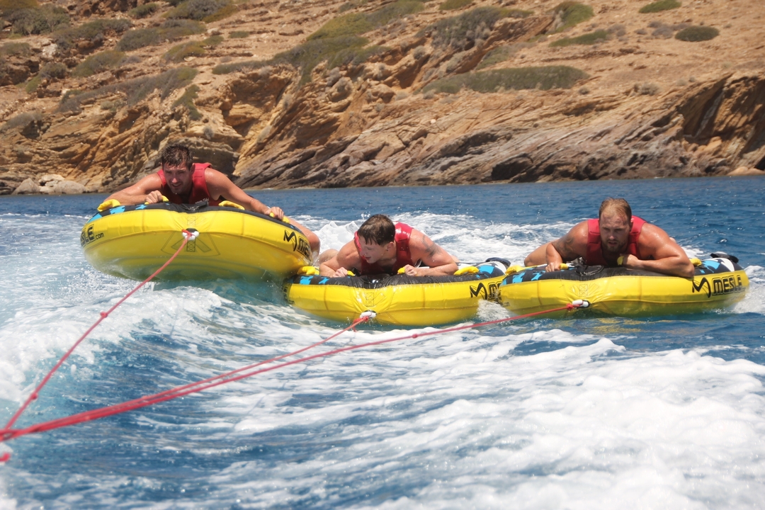 Group enjoying water tubing on a sunny day.