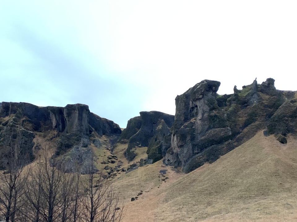 Rock formations in a rolling landscape.
