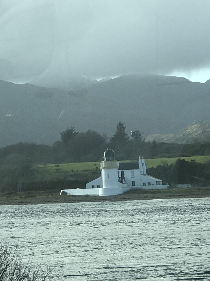 Lighthouse in a rural landscape.