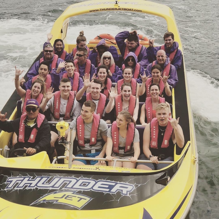 People on a speedboat enjoying a water ride.