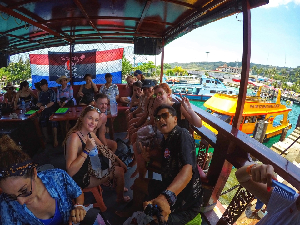 People on a boat dock enjoying the view and each other's company.