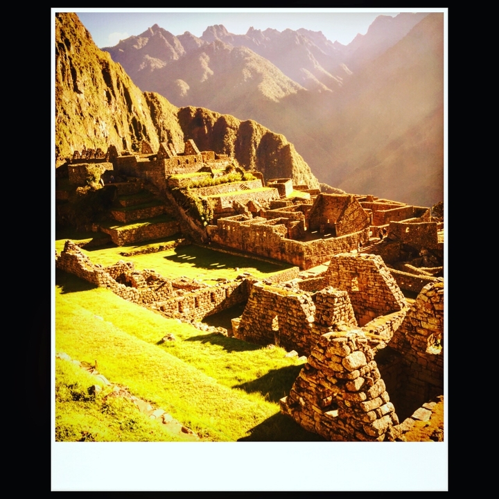 Close-up of Machu Picchu stone ruins during a sunny day.