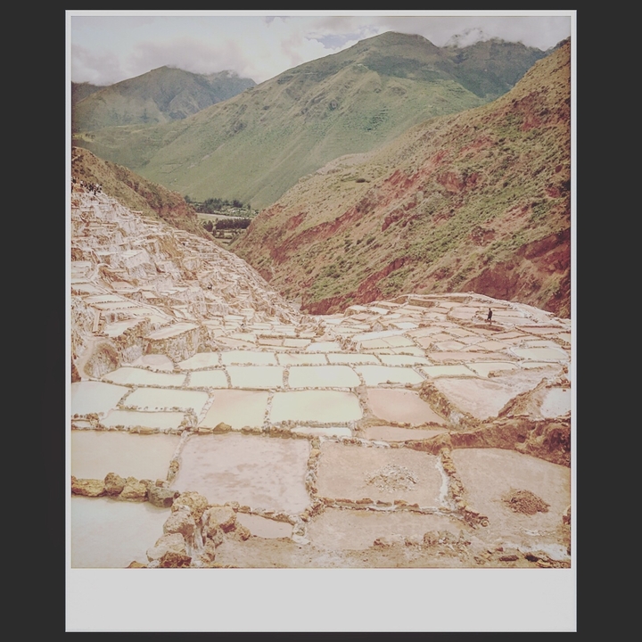Terraced salt ponds in a mountain setting.