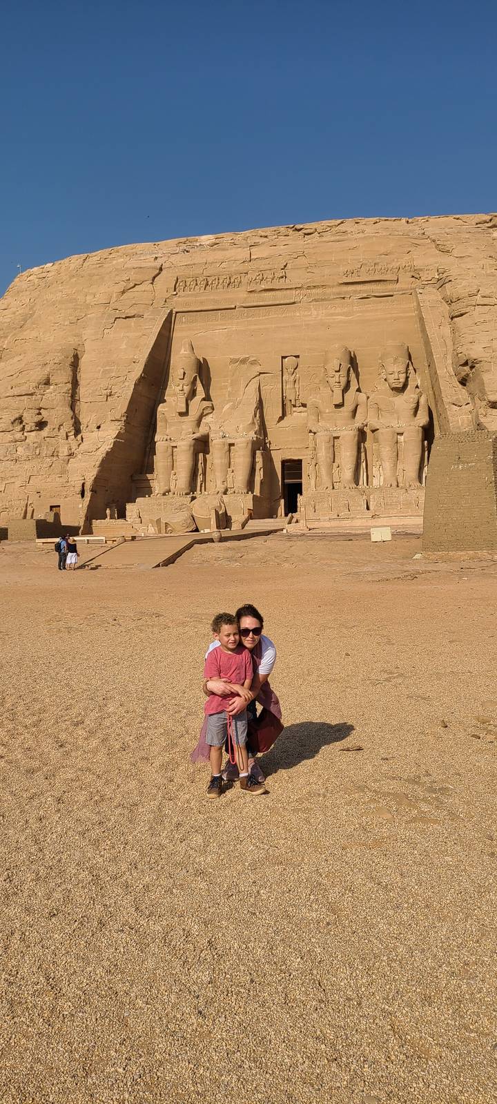 Two people in front of the Abu Simbel temples.
