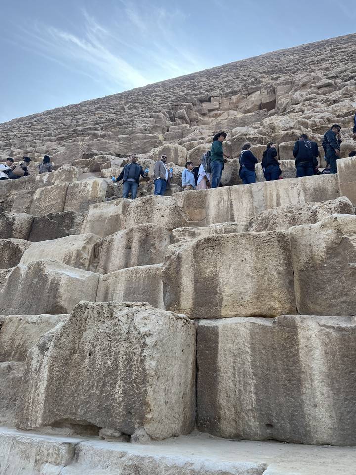 People climbing on pyramid stones translates to French as:
**Des gens qui grimpent sur les pierres de pyramide**
Alternative translations could be:
- "Des personnes grimpant sur les pierres de pyramide"
- "Des gens escaladant les pierres de pyramide"