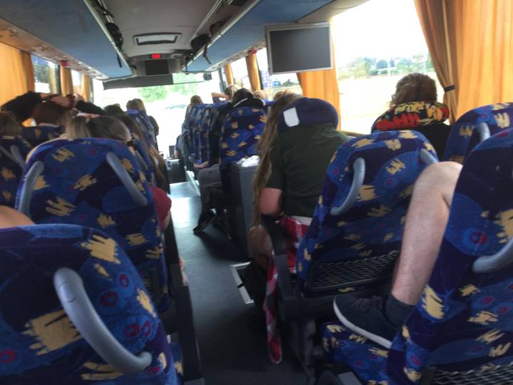 Passengers seated inside a bus.