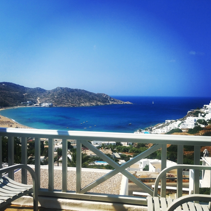 Panoramic view of a bay with clear blue waters.