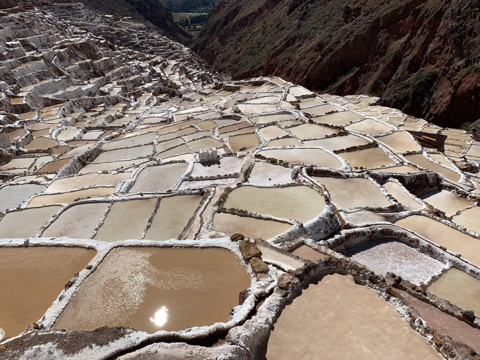 Aerial view of terraced salt pans.