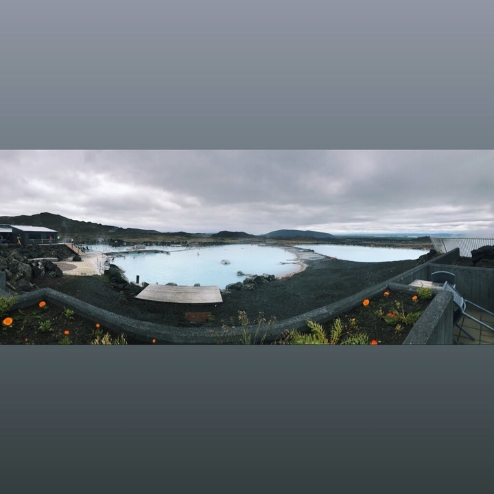 Panoramic view of a geothermal spa with overcast sky.
