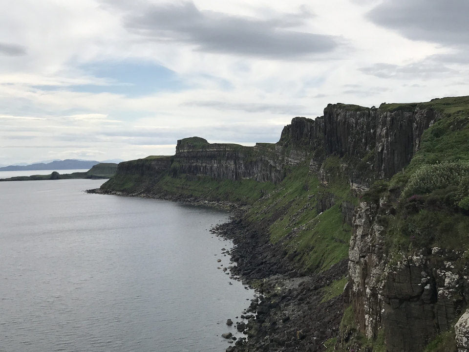 Long stretch of cliffs along the coast with sea view in Scotland.