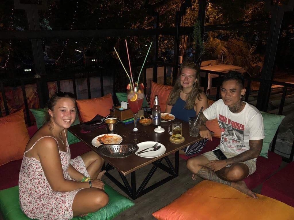 Group of friends dining at a cozy restaurant in the evening.