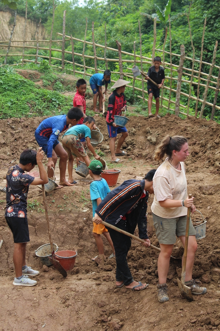 A group of people working together on a construction site.