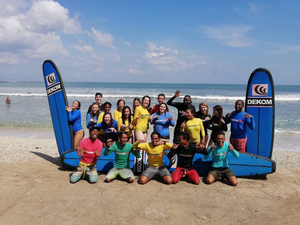 Group surf lesson on the beach.