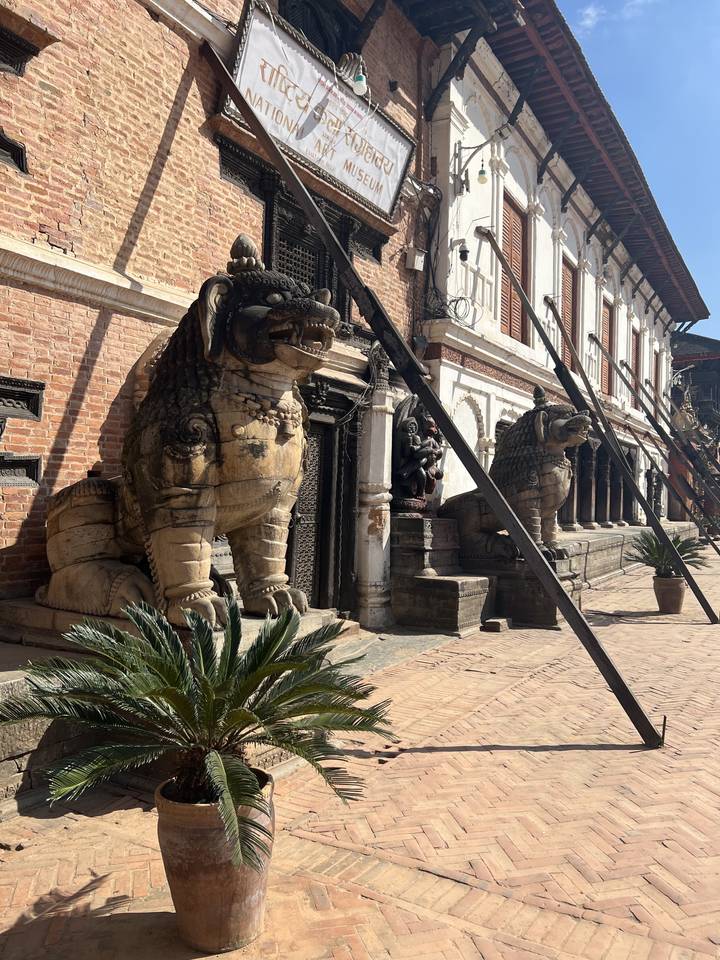 A museum with stone sculptures in a courtyard.