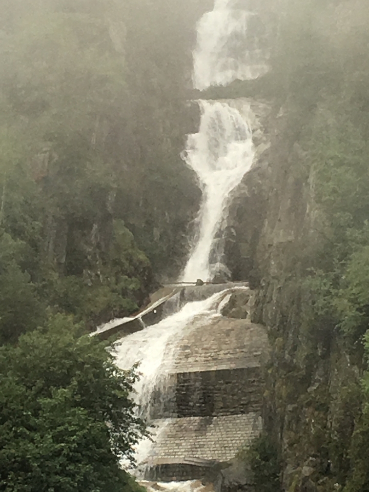 A blurry waterfall cascading down rocks.