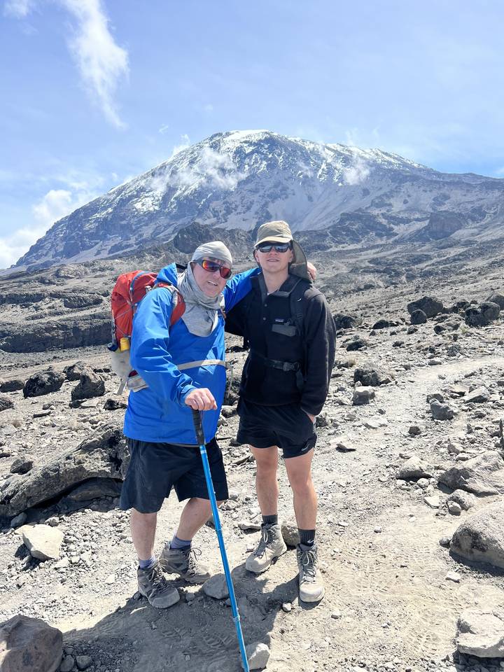 Two hikers on a mountain path.
