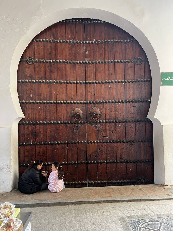 Large wooden door with two people